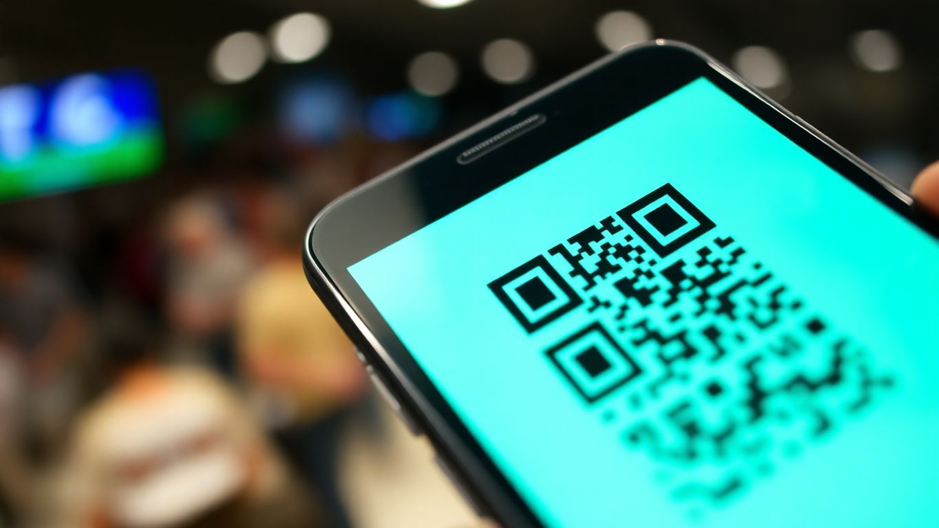 Smartphone displaying a green COVID QR code.